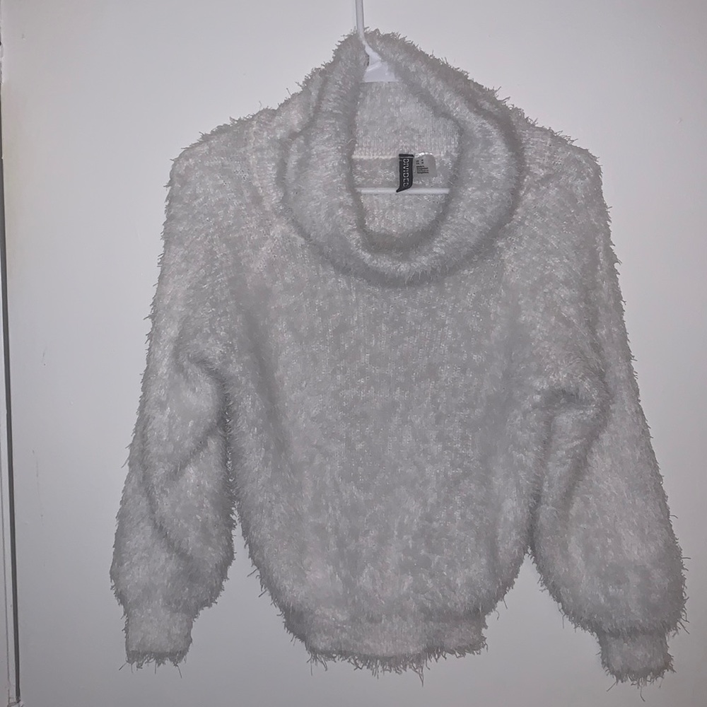 Feathered turtle neck sweater